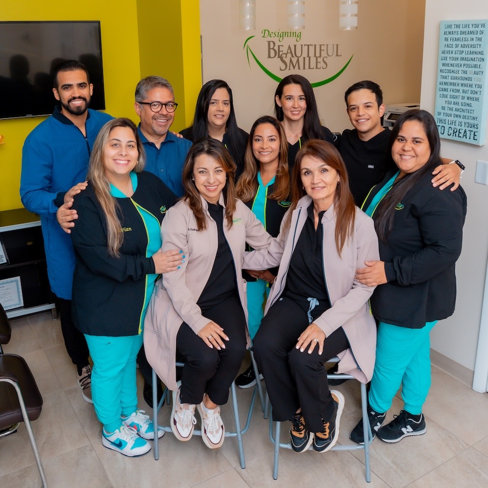 Designing Beautiful Smiles dental team welcoming a patient